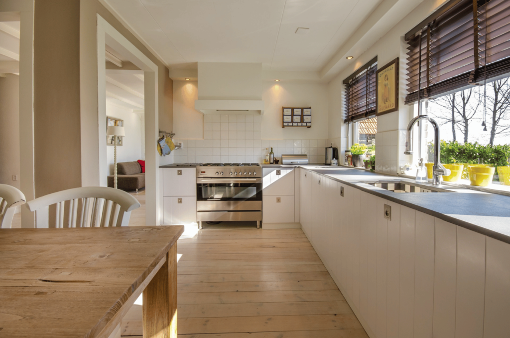 kitchen with white counters and sparkling hardwood floors